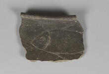 Brown rim sherd with etched fish design