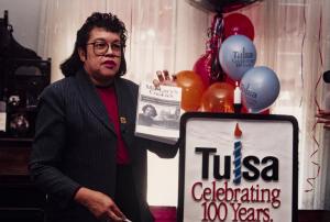 Eddie Faye Gates in 1998 holding her first book, Miz Lucy’s Cookies